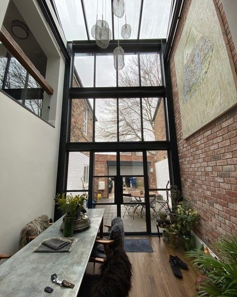 Aluminium heritage doors replicate the elegance of traditional steel, offering slim frames and timeless style