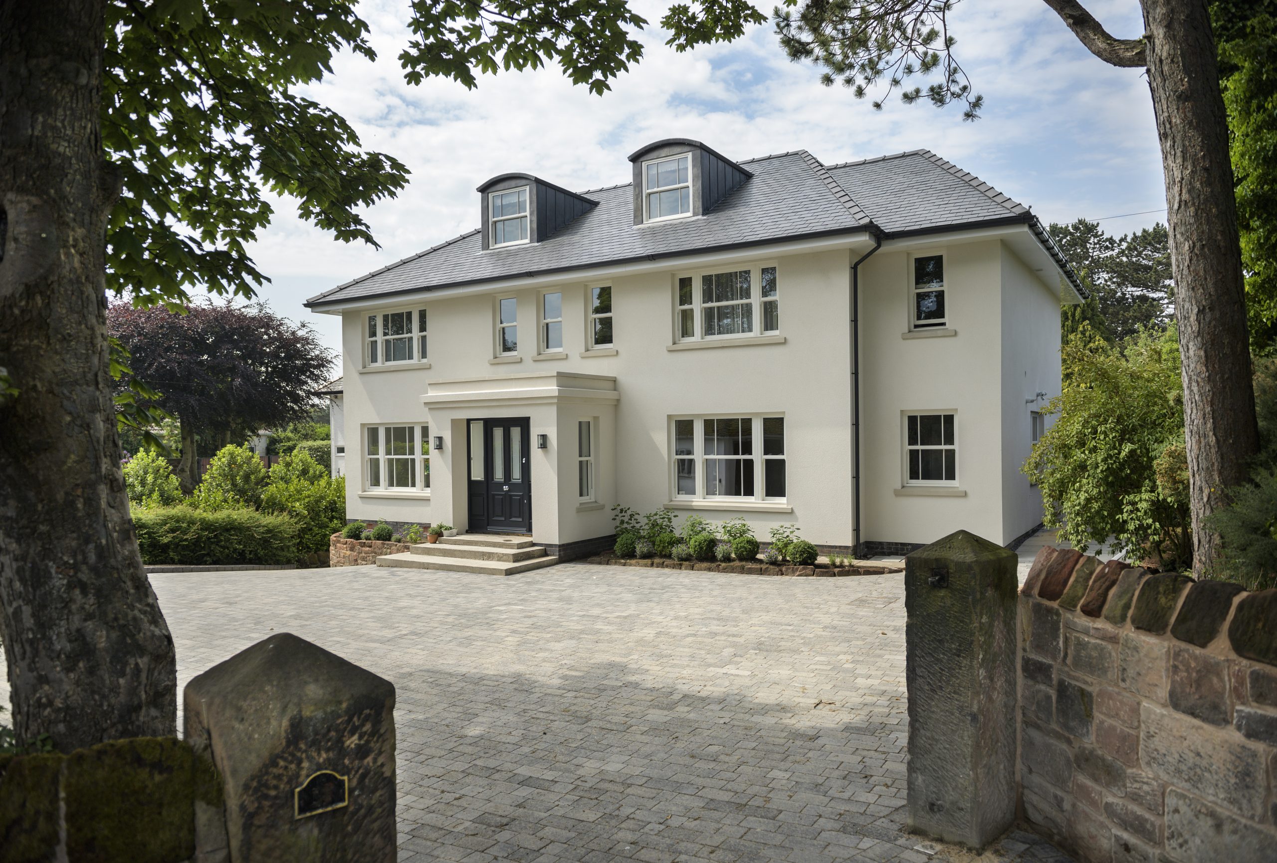 Traditional sliding sash windows enhancing a modern home's character.