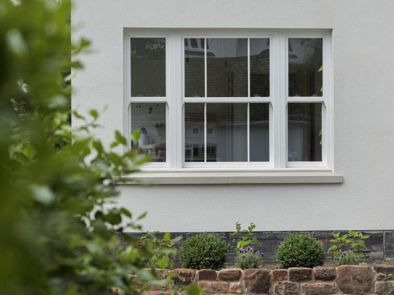 Upgrade to uPVC Sliding Sash Windows with Heritage Features for Emma and Henry's bungalow.