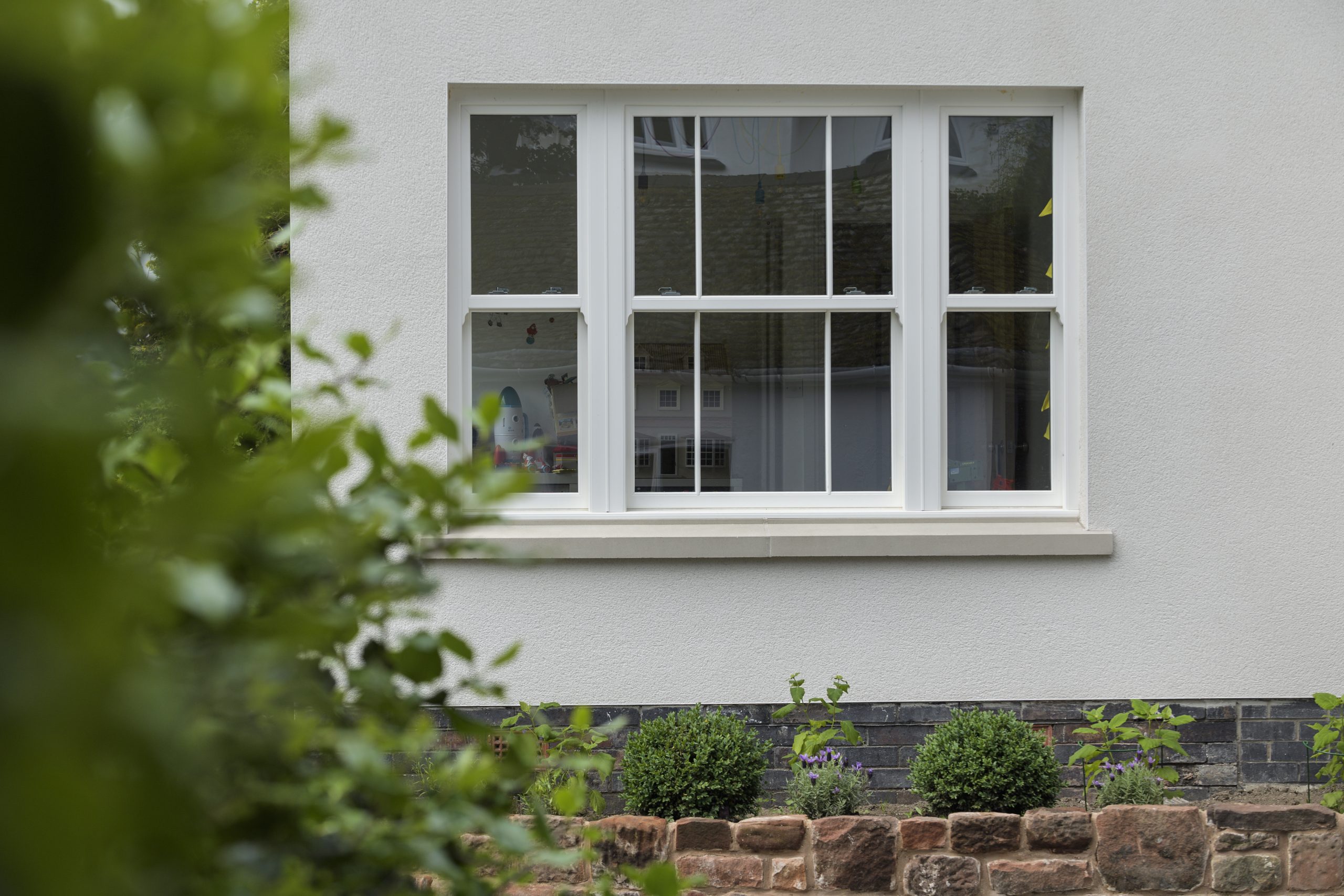 Upgrade to uPVC Sliding Sash Windows with Heritage Features for Emma and Henry's bungalow.