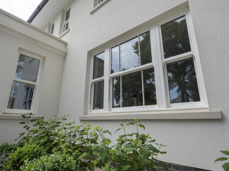 Combination of traditional elegance and modern functionality in windows.