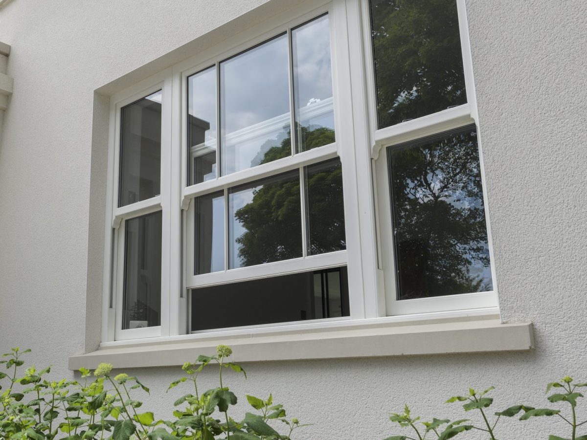 White sliding sash window with energy-efficient double glazing and an 'A' energy rating
