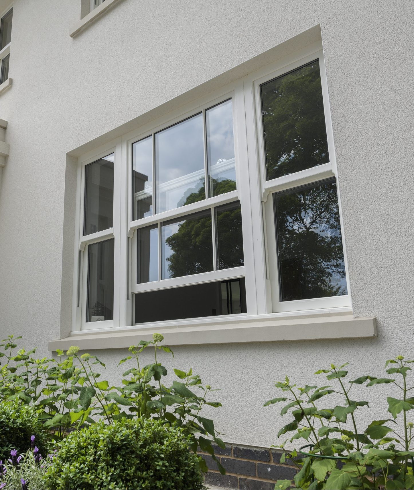 White sliding sash window with energy-efficient double glazing and an 'A' energy rating
