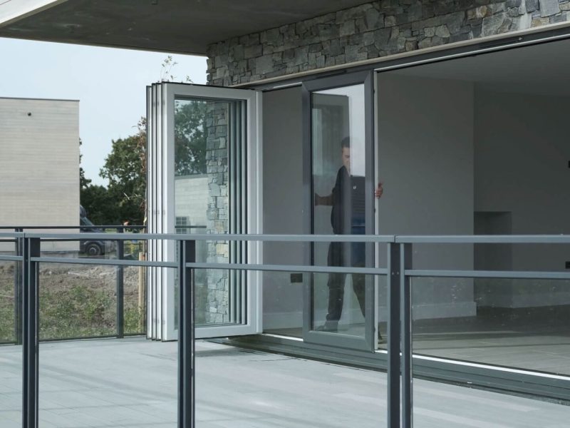 An image of slide-and-turn doors with flexible, individually folding panels.