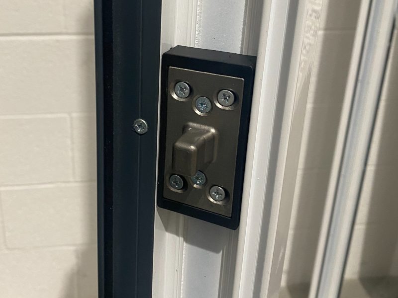 enhanced door bolt on a white upvc door frame