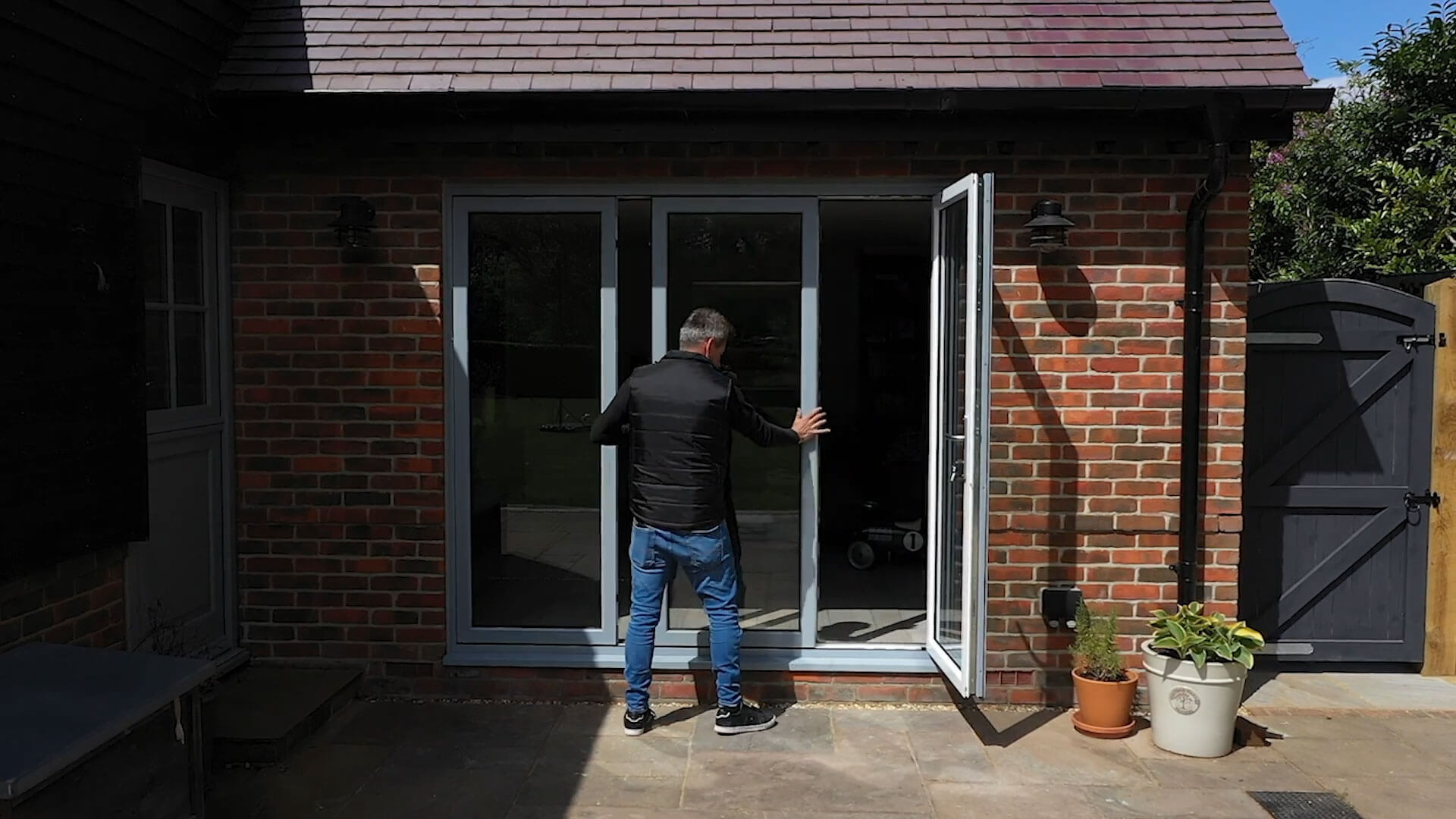 Sleek patio doors showcasing slide and swing functionality, embodying effortless elegance in a modern interior