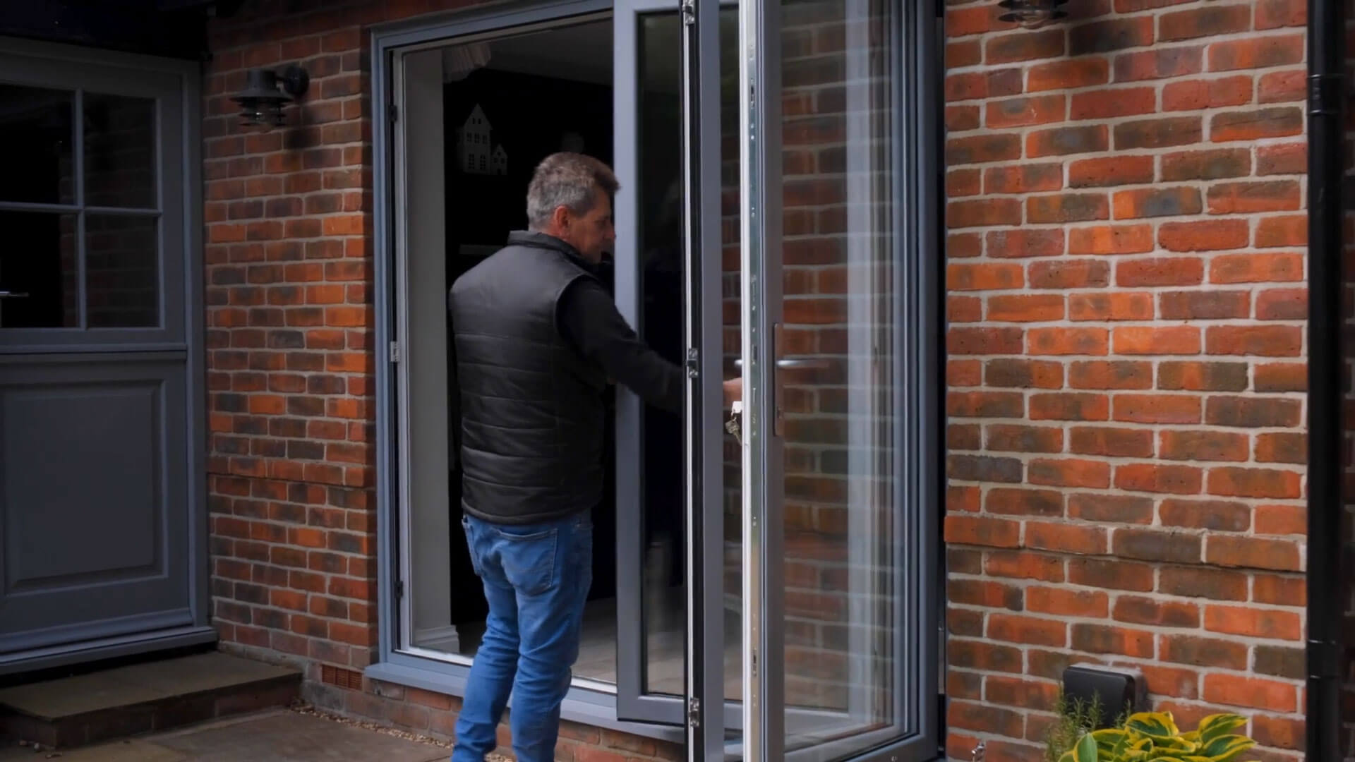 A patio adorned with slide and stack doors, inviting abundant natural light and fresh air into the home