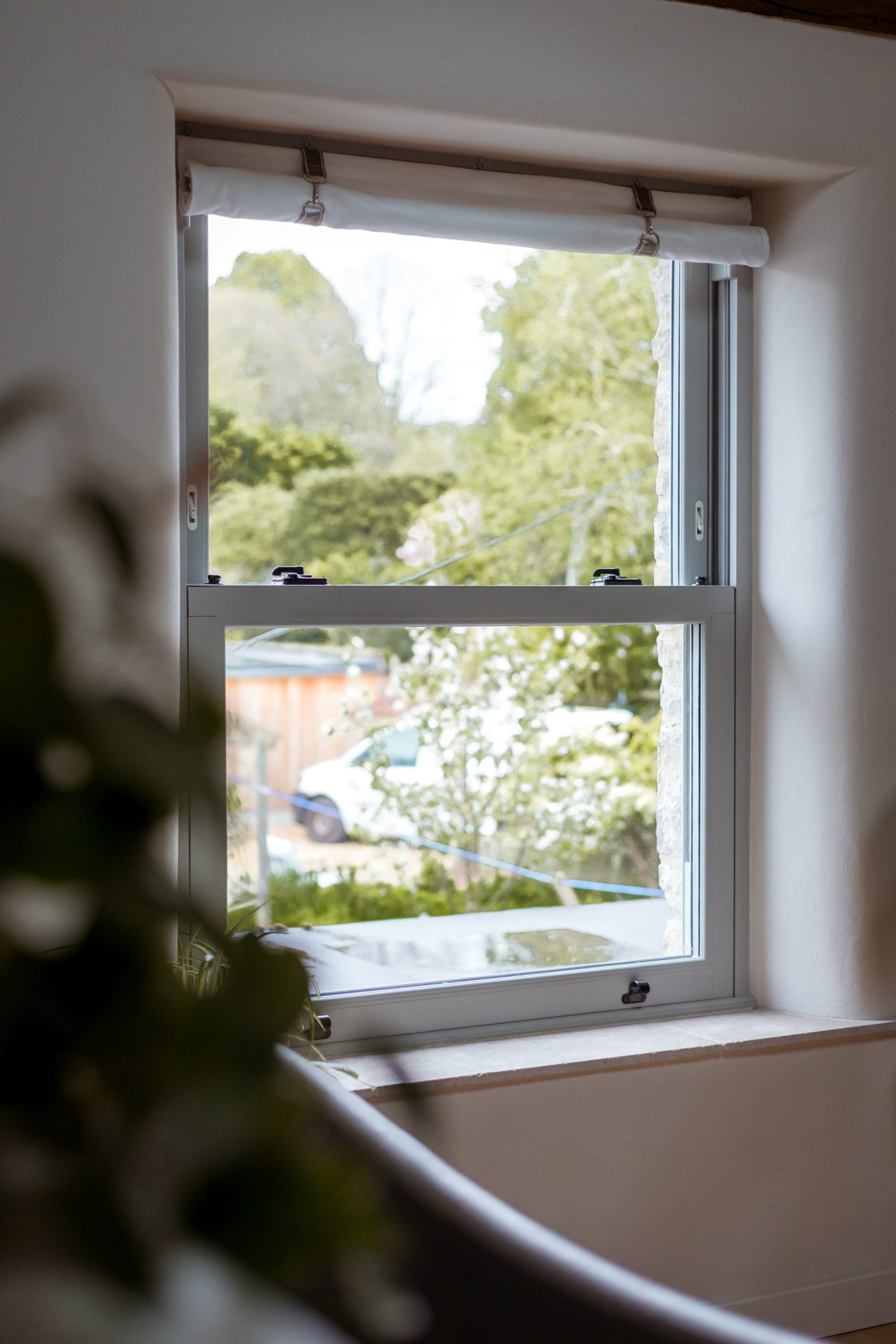 Agate grey woodgrain finish Legacy sliding sash windows installed in Georgian house.