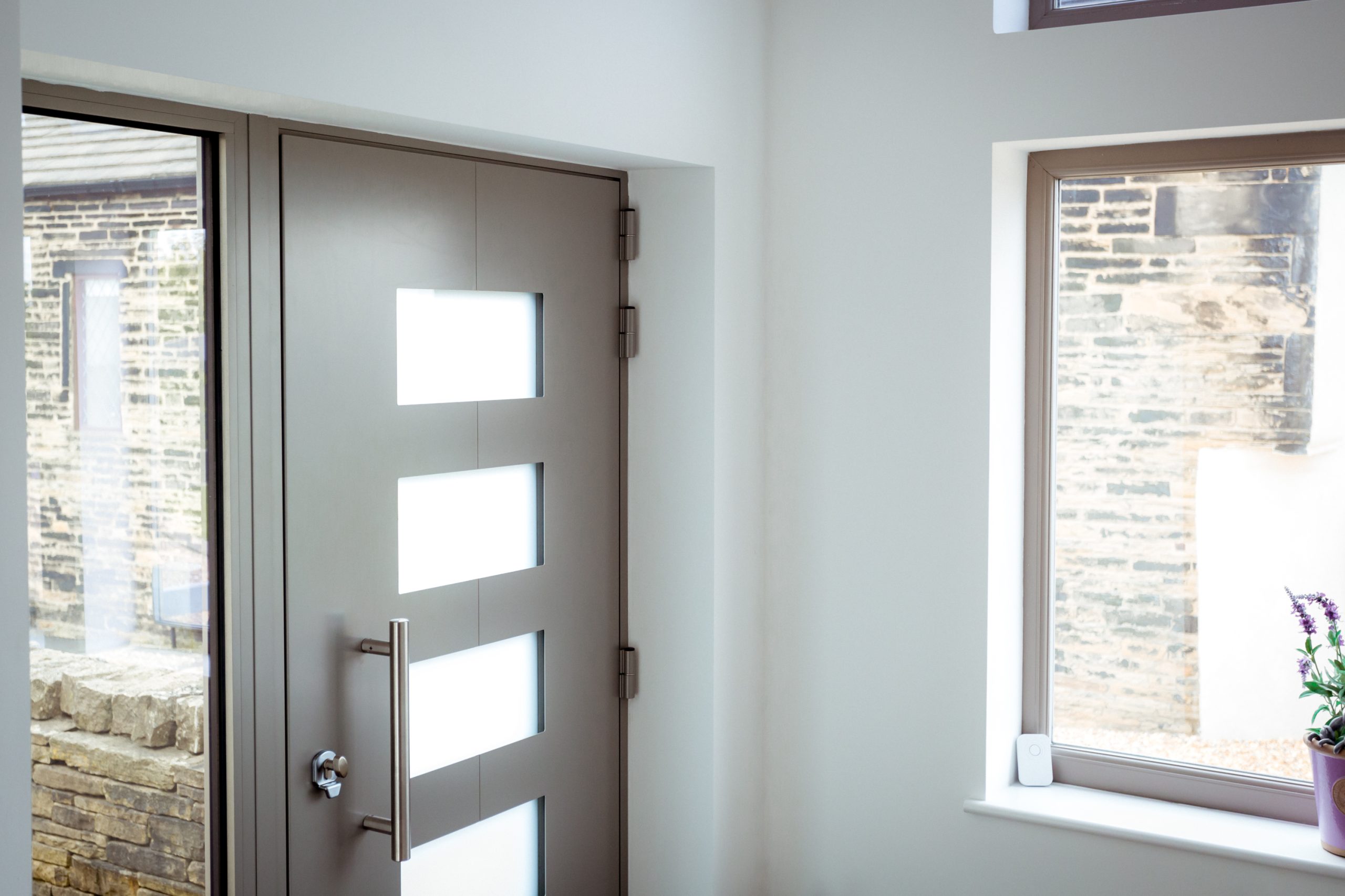 Quickslide's bespoke aluminium front door with satin glass, a unique style choice
