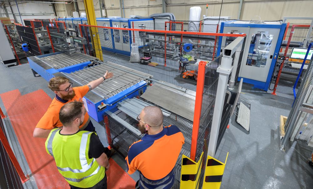 State-of-the-art machinery in a factory producing uPVC sash windows efficiently.