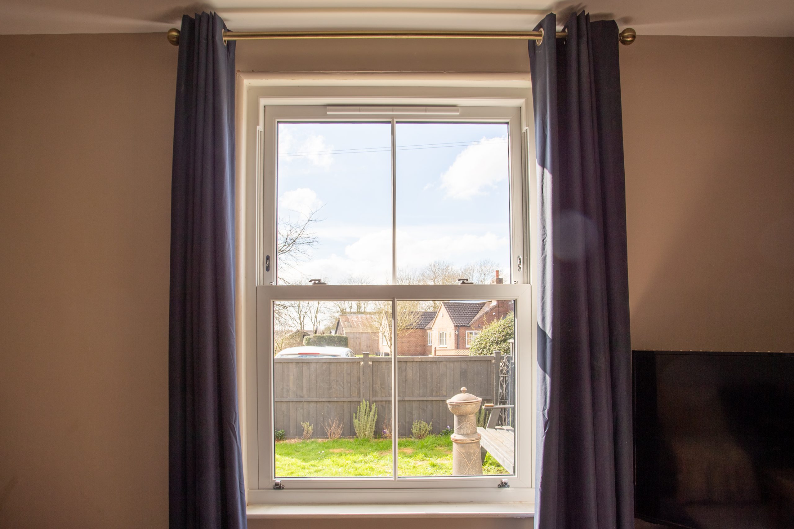 Close-up of anthracite grey flush uPVC windows, highlighting modern craftsmanship.