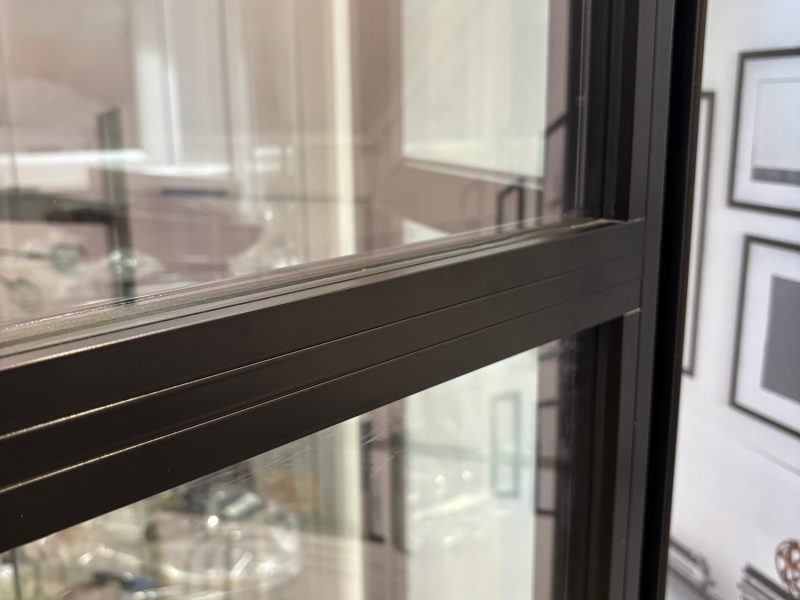 Close-up of slim aluminium frames designed to replicate classic steel-look heritage door styles