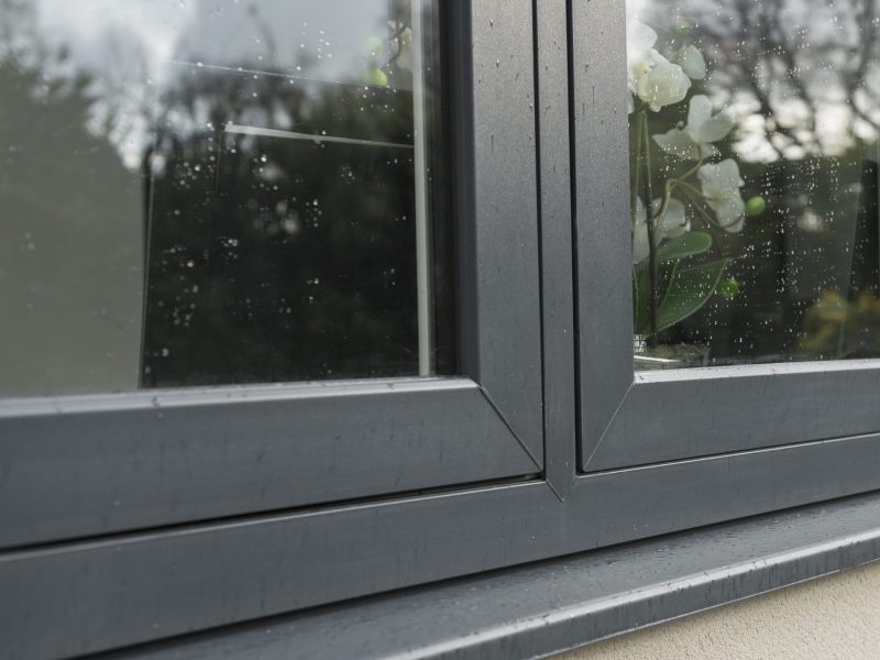 Close-up of 45° corner welds on a uPVC flush sash window, showcasing a seamless, robust finish