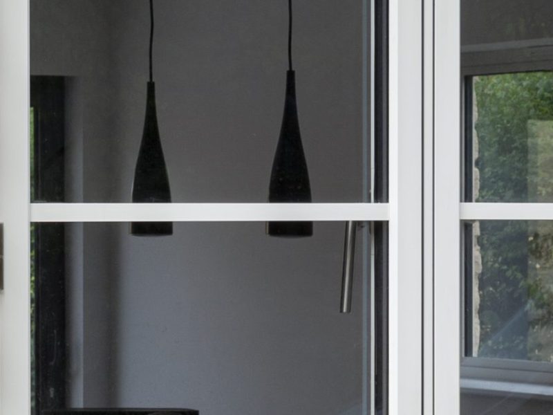 Close-up of flat surface bars on an aluminium window frame, highlighting the clean, modern design