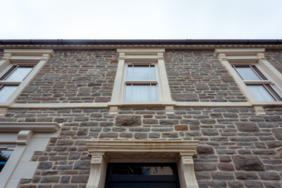 PVC sliding sash windows, always glazed, with sashes occasionally supplied loose for weight reduction during transport