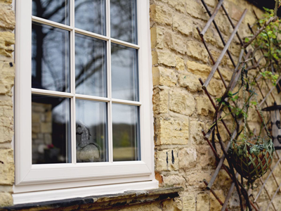 PVC casement windows, generally glazed, with the occasional loose glass unit to reduce weight during transport