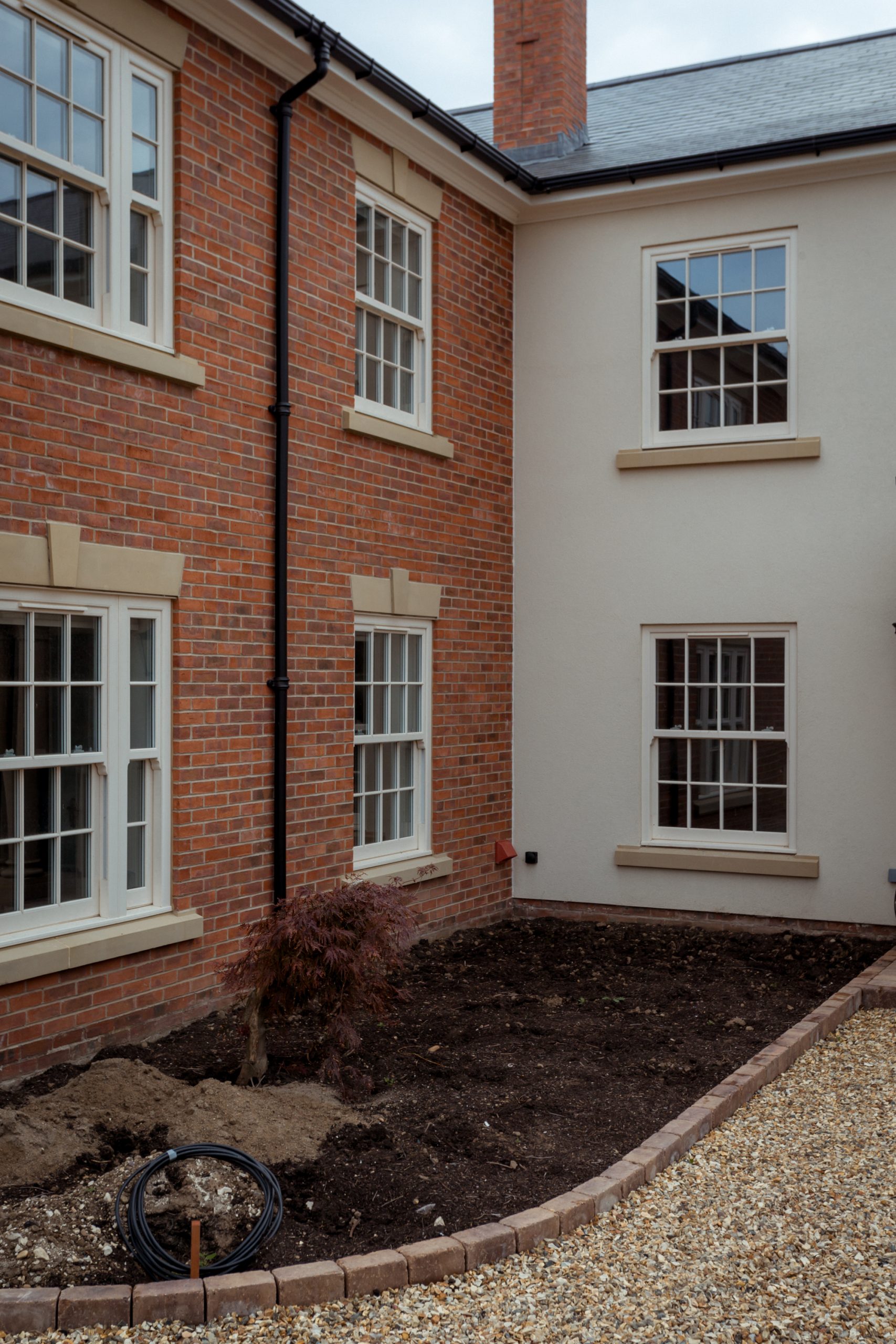 Cream woodgrain heritage sash windows installed by JF Bodman in Yorkshire.