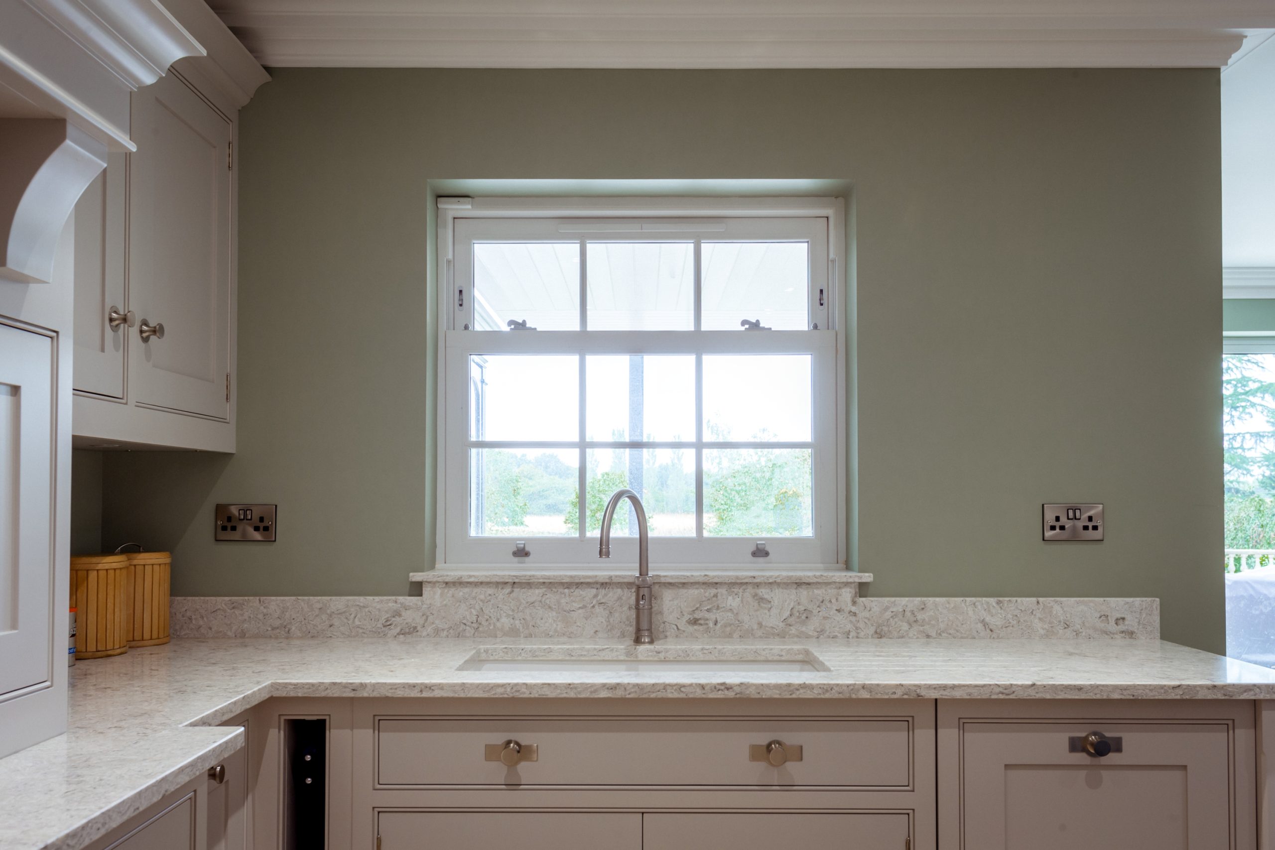 Energy-efficient cream sash windows with a traditional timber look.