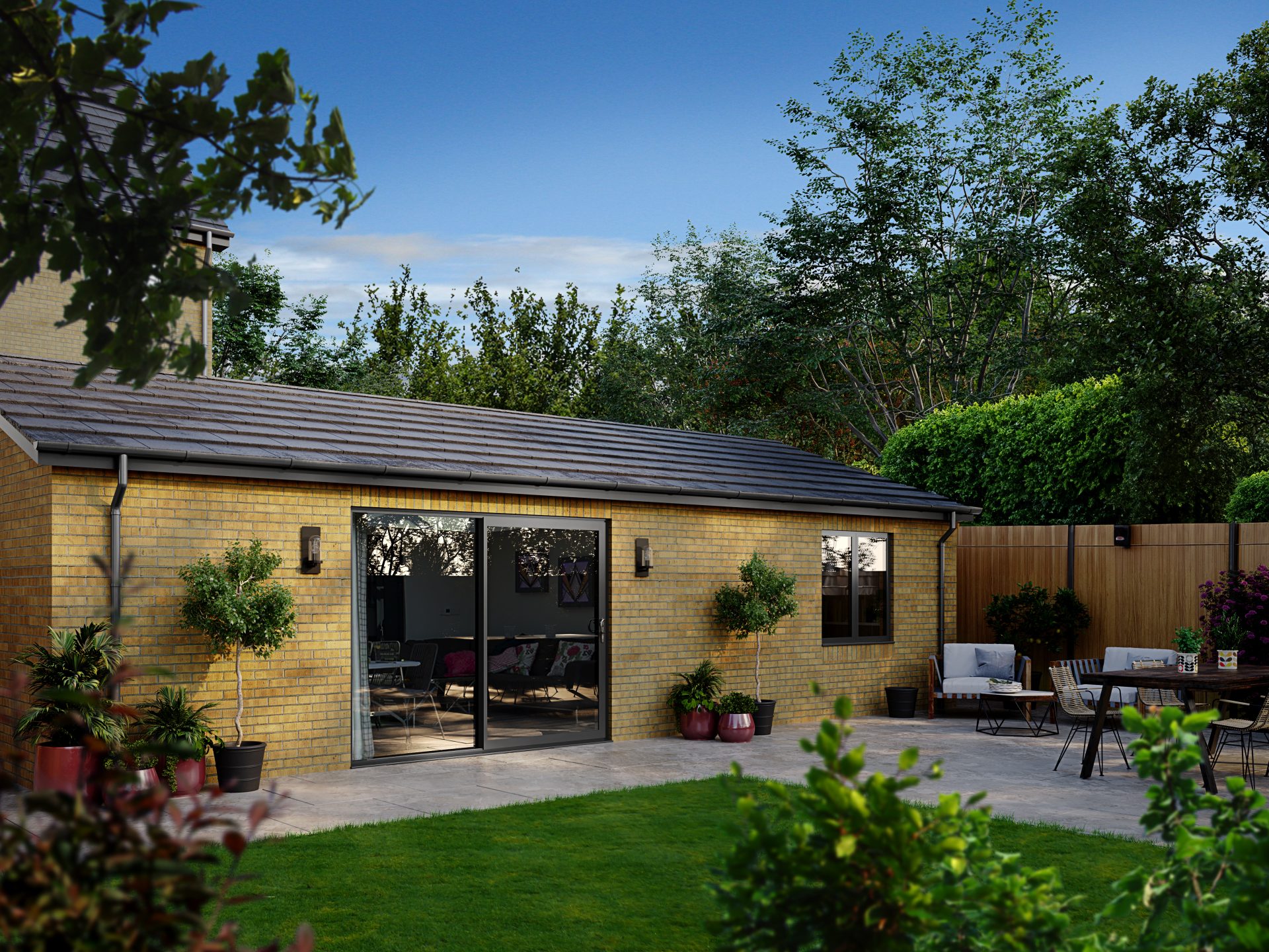 Slim-framed aluminium sliding doors with full-height glass panels for panoramic garden views