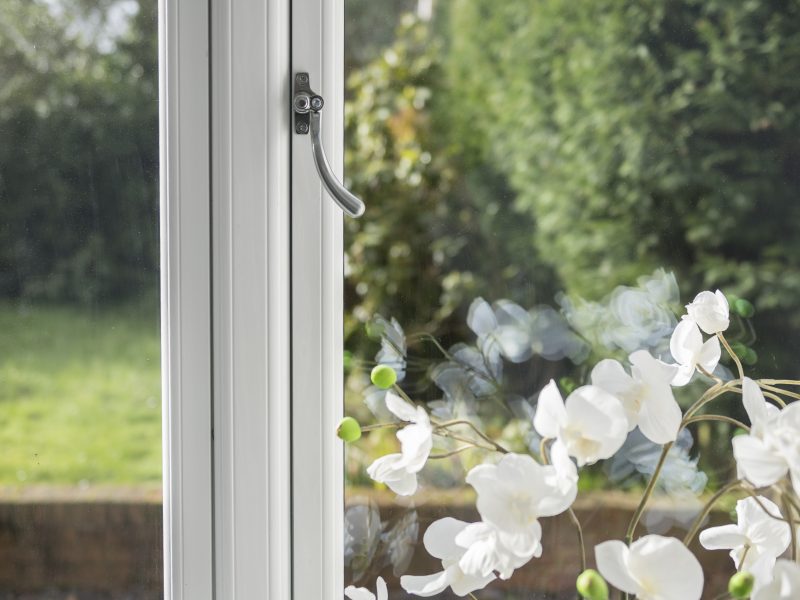 Hardware options for uPVC flush casement windows, featuring in-line, monkey tail, and tear drop handles