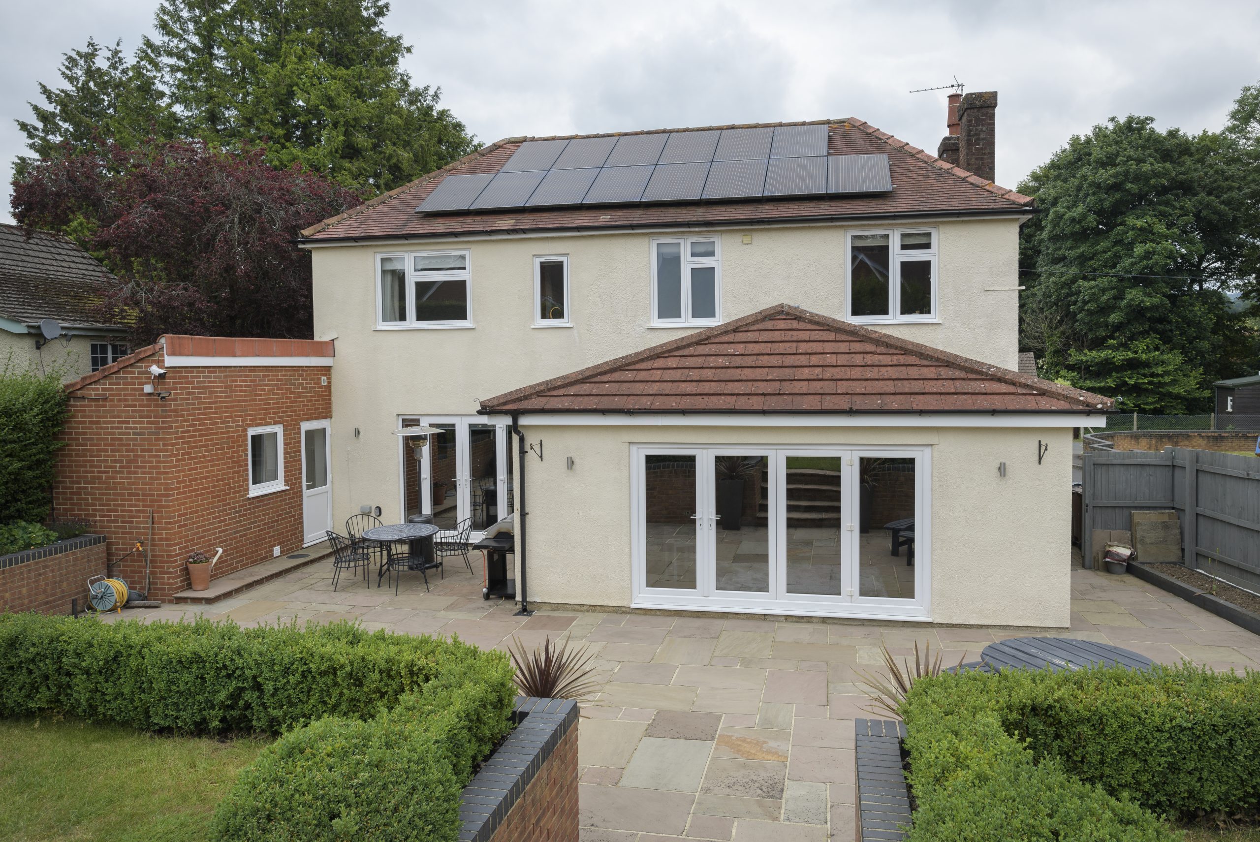 White flush casement windows in a symmetrical configuration on a modern property