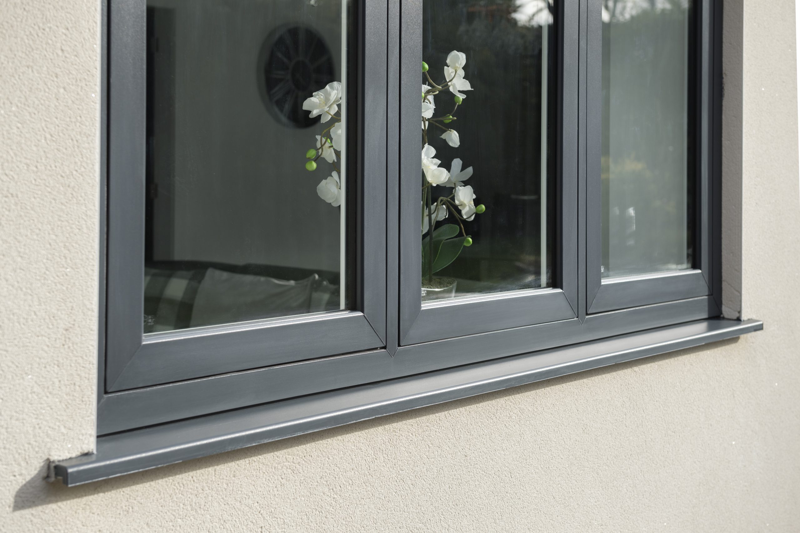 Modern black flush sash window fitted in a contemporary home