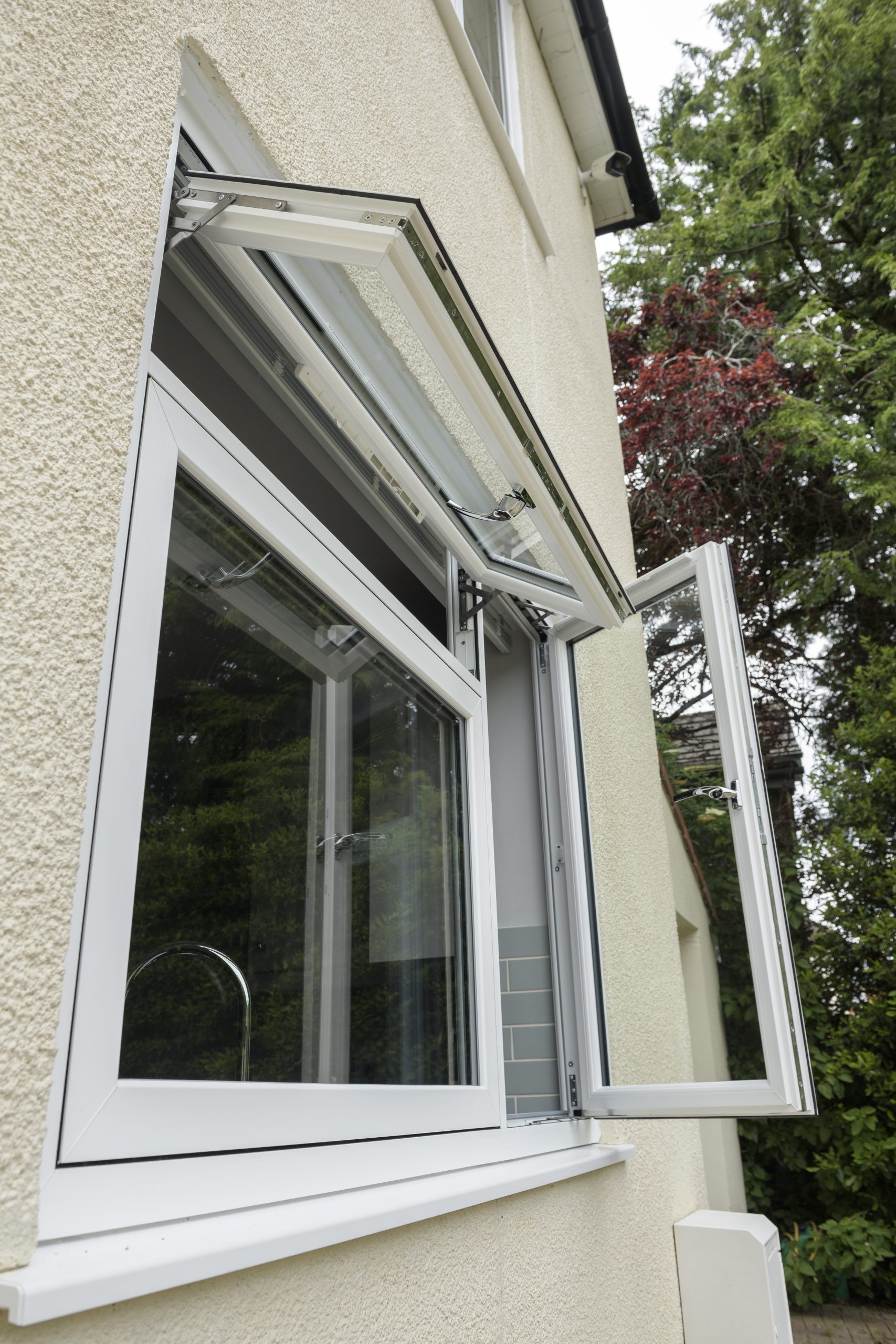 White flush casement window with a sleek, traditional finish.