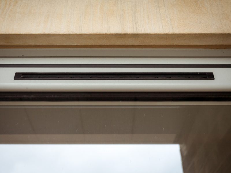 Discreet trickle vent in aluminium bifold doors for improved airflow and condensation control