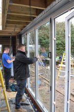 Compliant aluminium bifold doors meeting PAS 24 and BS 6375 standards