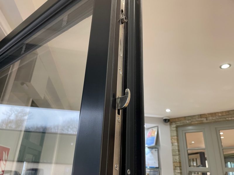 Close-up of Aluminium French Doors with sleek frames and large glazed panels, offering a stylish and secure entrance