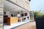 Bifold doors framing a clear view of a landscaped garden, even when closed