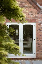 Double uPVC French doors with premium swan and lever handles, perfect for style and security