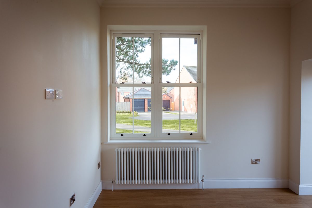 Energy-efficient uPVC sliding sash window with authentic heritage look.