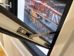 Close-up of reinforced metal tilt arms designed for durable and reliable sash window movement