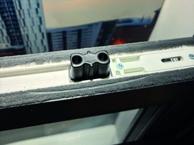 Detailed view of top sash security bolts providing added security to sliding sash windows