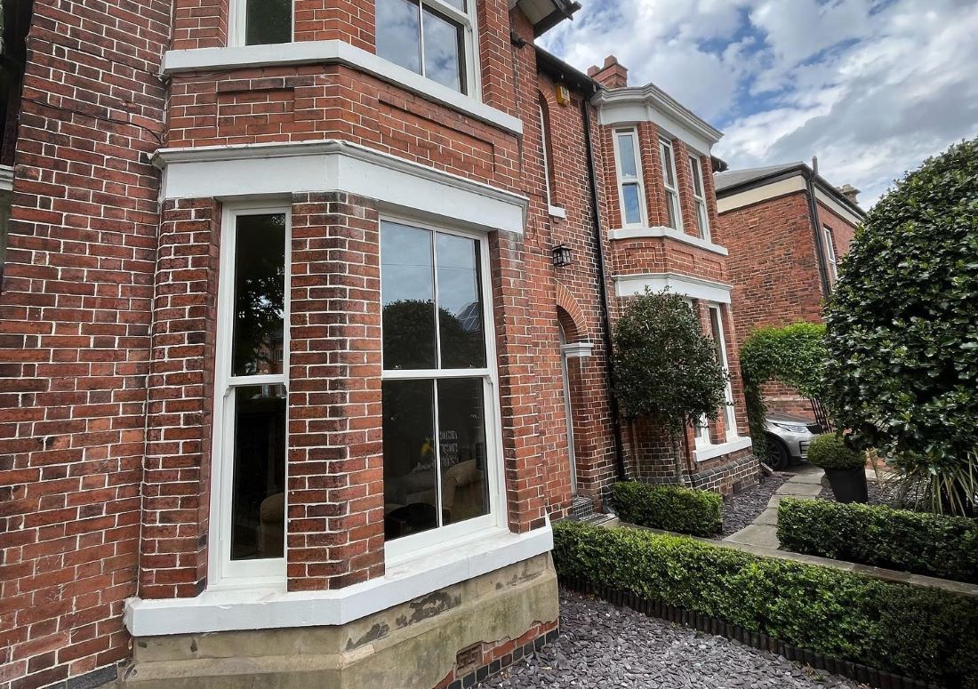 Modern uPVC bay window with panoramic views and elegant finish.