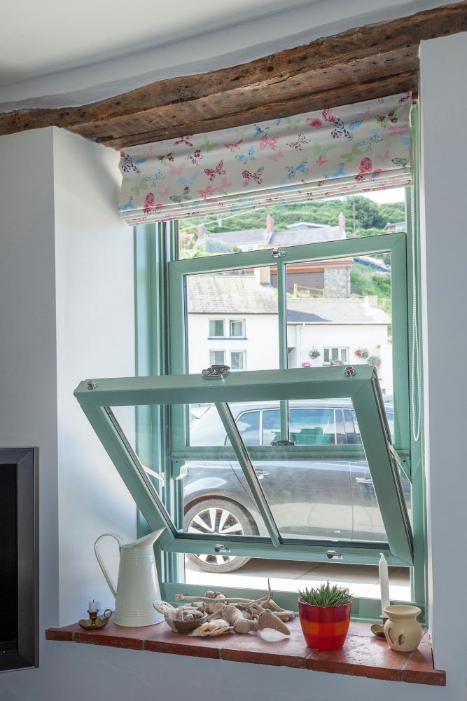 View of uPVC window from inside a modern kitchen letting in natural light