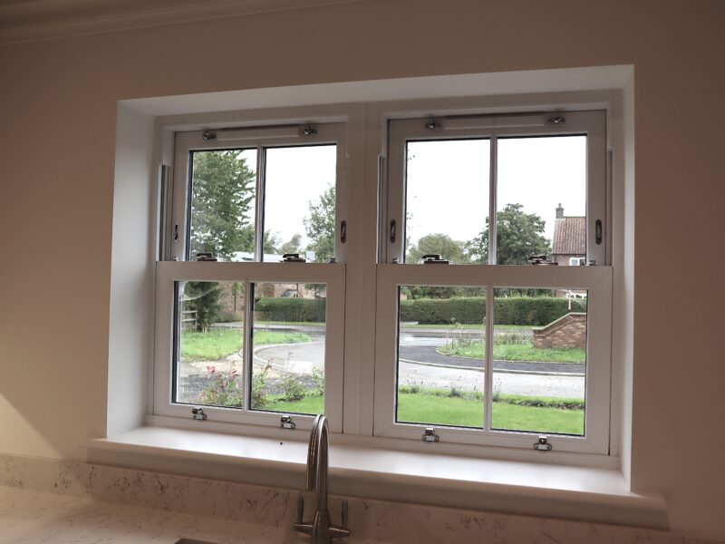 Close-up of agate grey sash window frame showing modern detailing and heritage styling.