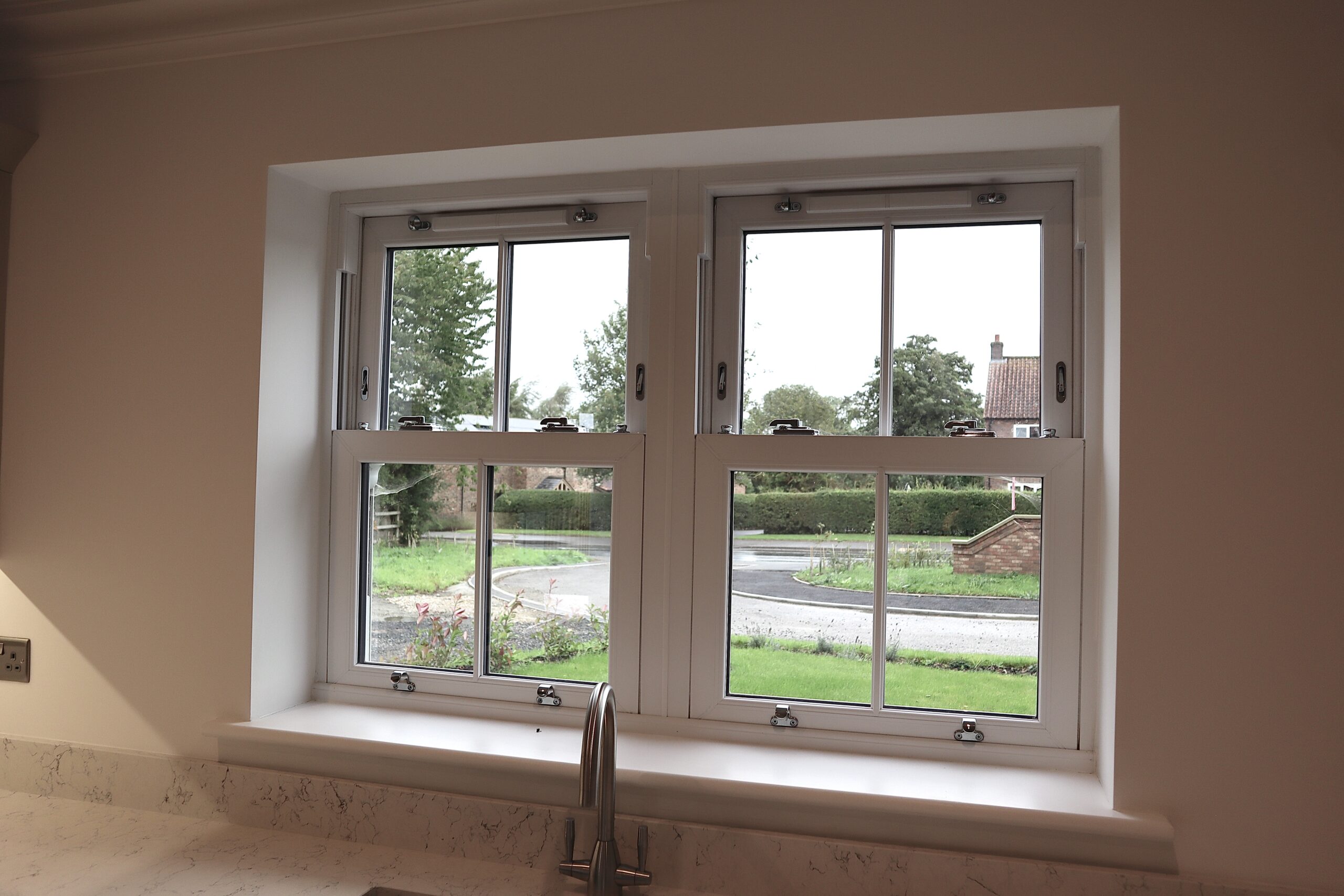 Close-up of agate grey sash window frame showing modern detailing and heritage styling.