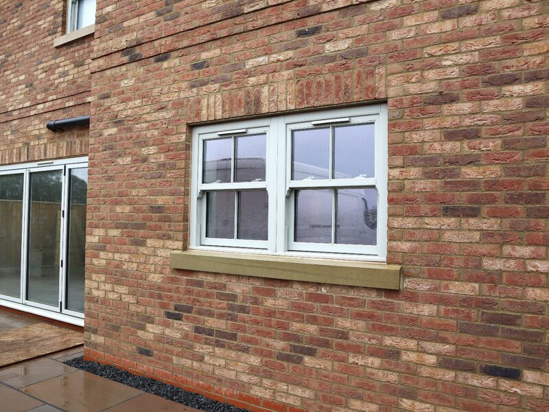 Side elevation of Yorkshire Homes property with multiple sash windows installed