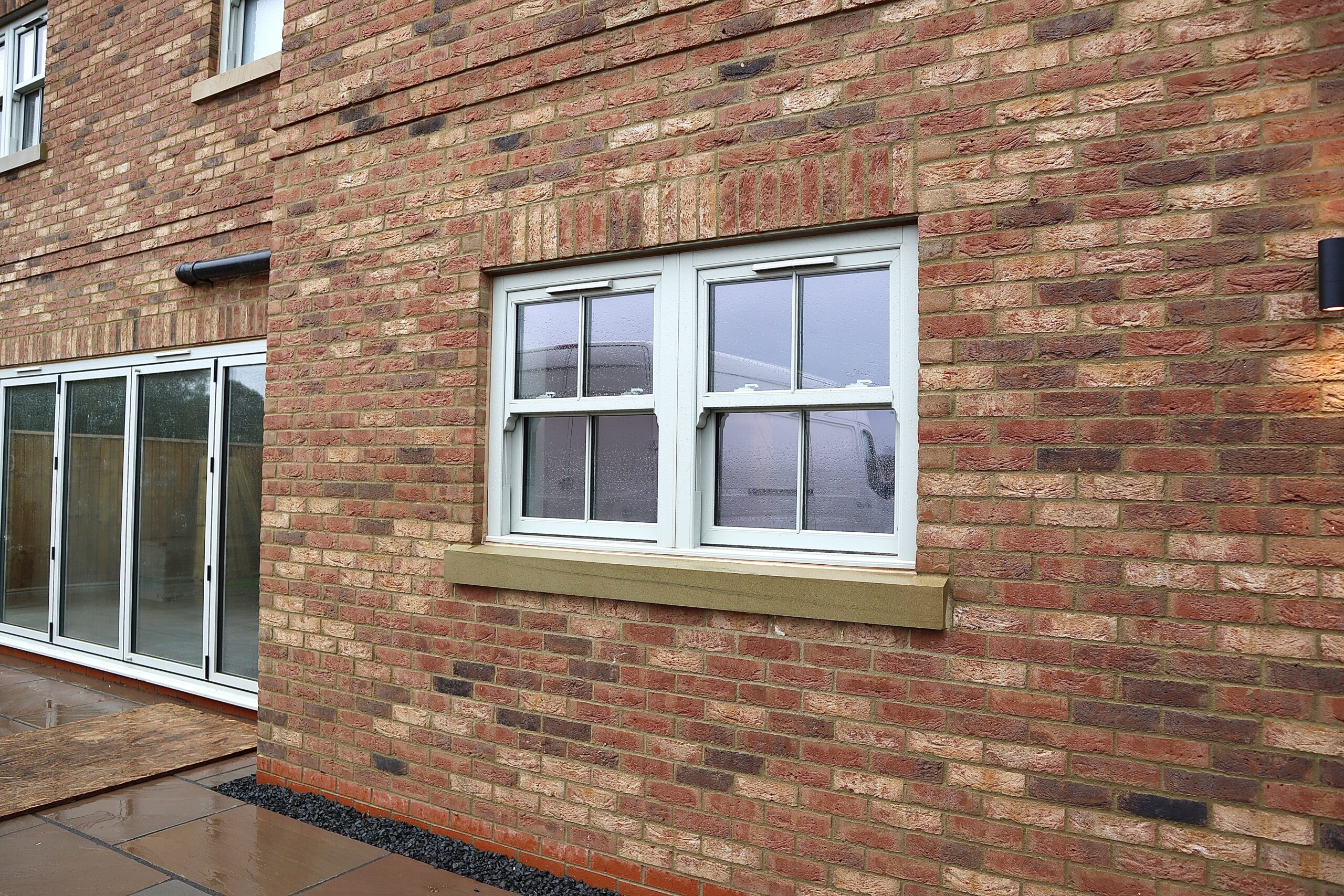 Side elevation of Yorkshire Homes property with multiple sash windows installed