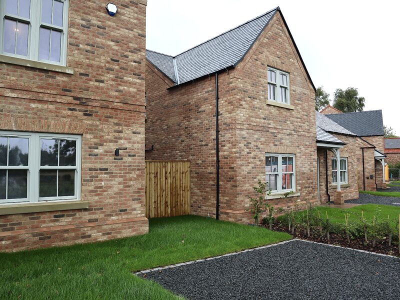 Heritage-style sash window design complementing modern construction and exterior finishes