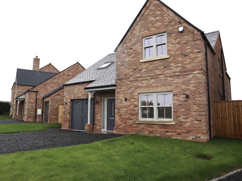 Agate grey uPVC sliding sash windows installed on a luxury Yorkshire Homes property