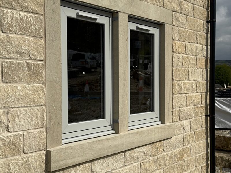 Close-up of agate grey flush casement windows supplied by Quickslide for SB Homes