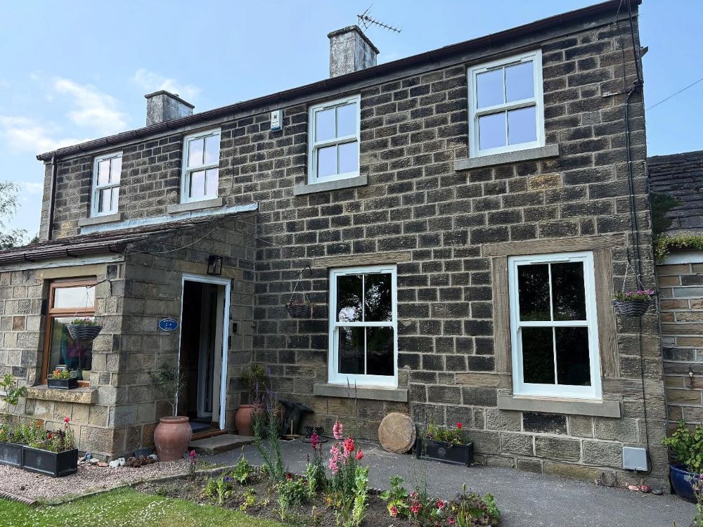 Heritage uPVC sash windows with traditional proportions and slim midrail design