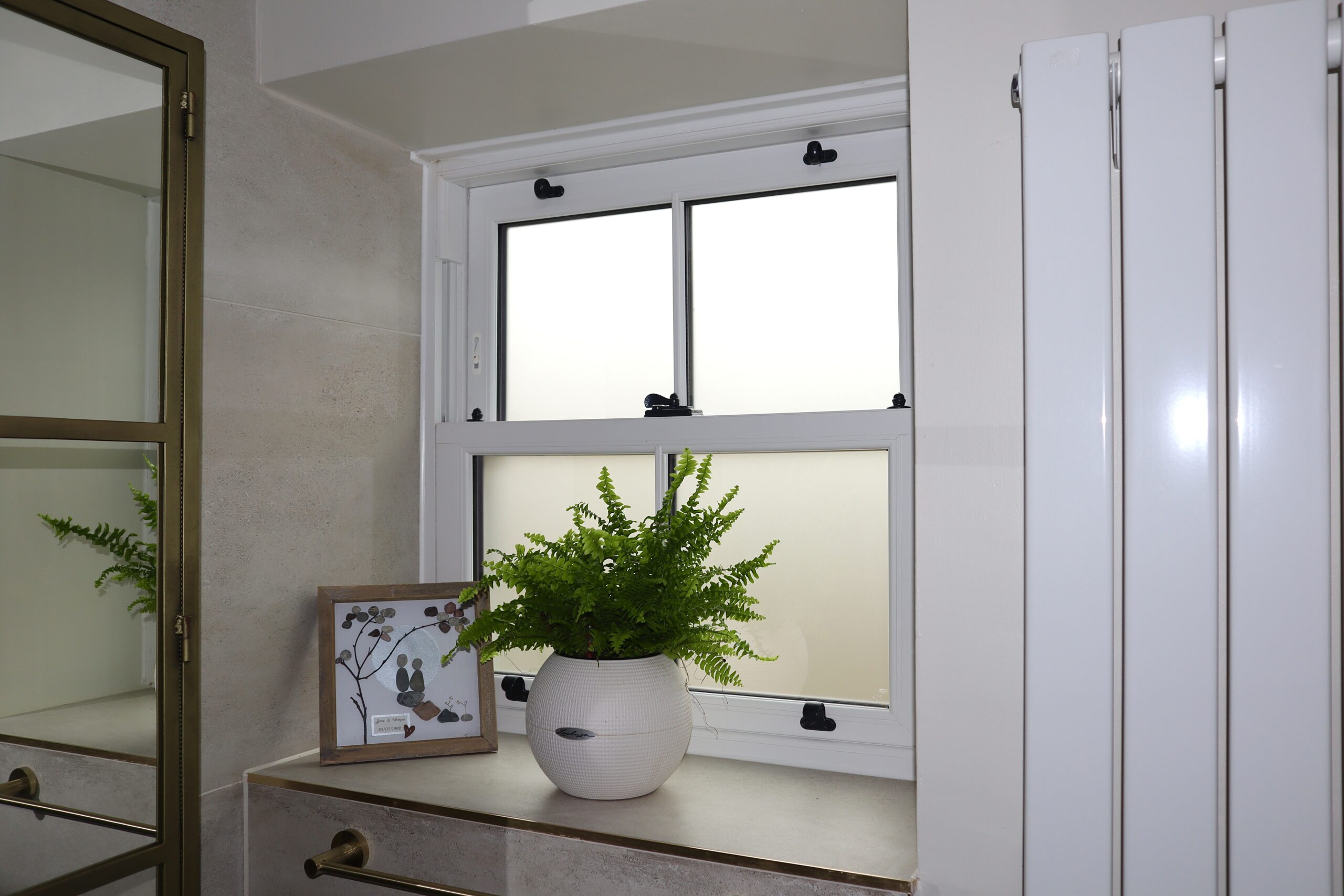 Conservation-approved uPVC sash windows with slim midrail and traditional proportions