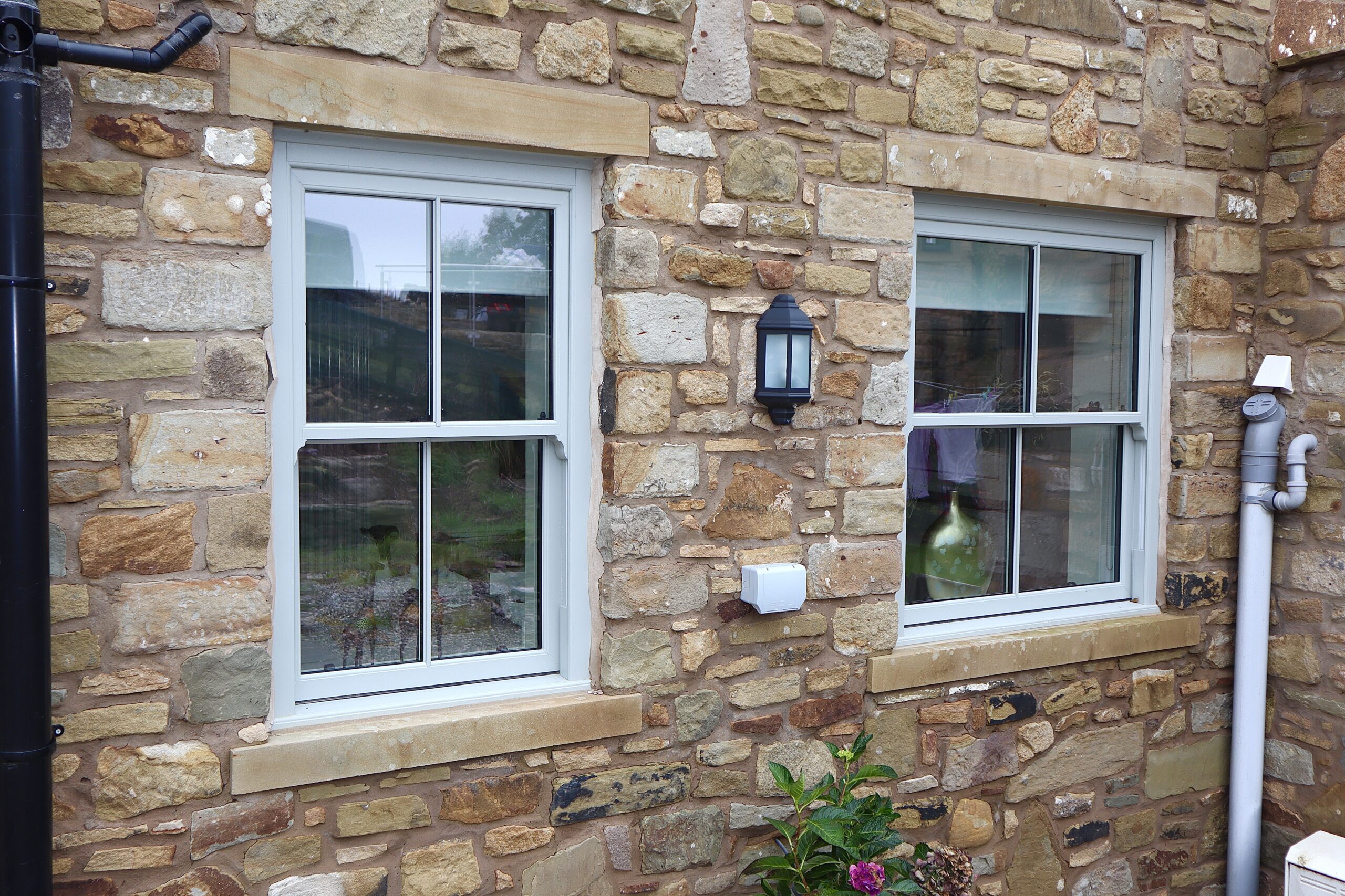 Agate grey uPVC sliding sash windows installed on a Lancashire conservation area home