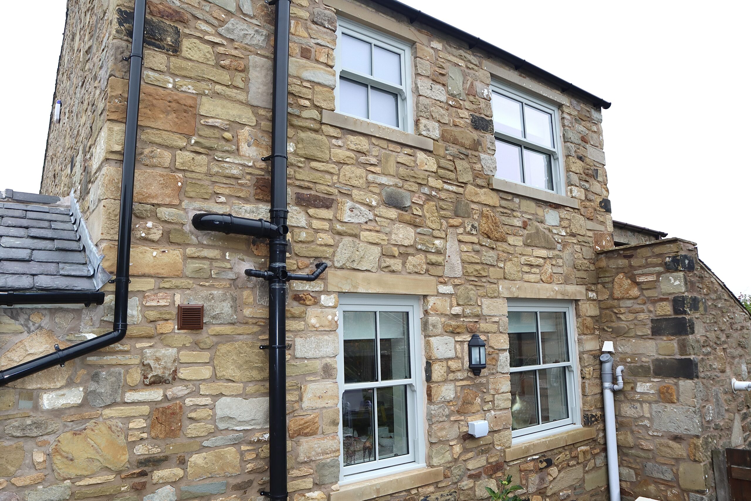 Agate grey sliding sash windows installed on a conservation project near Pendle Hill