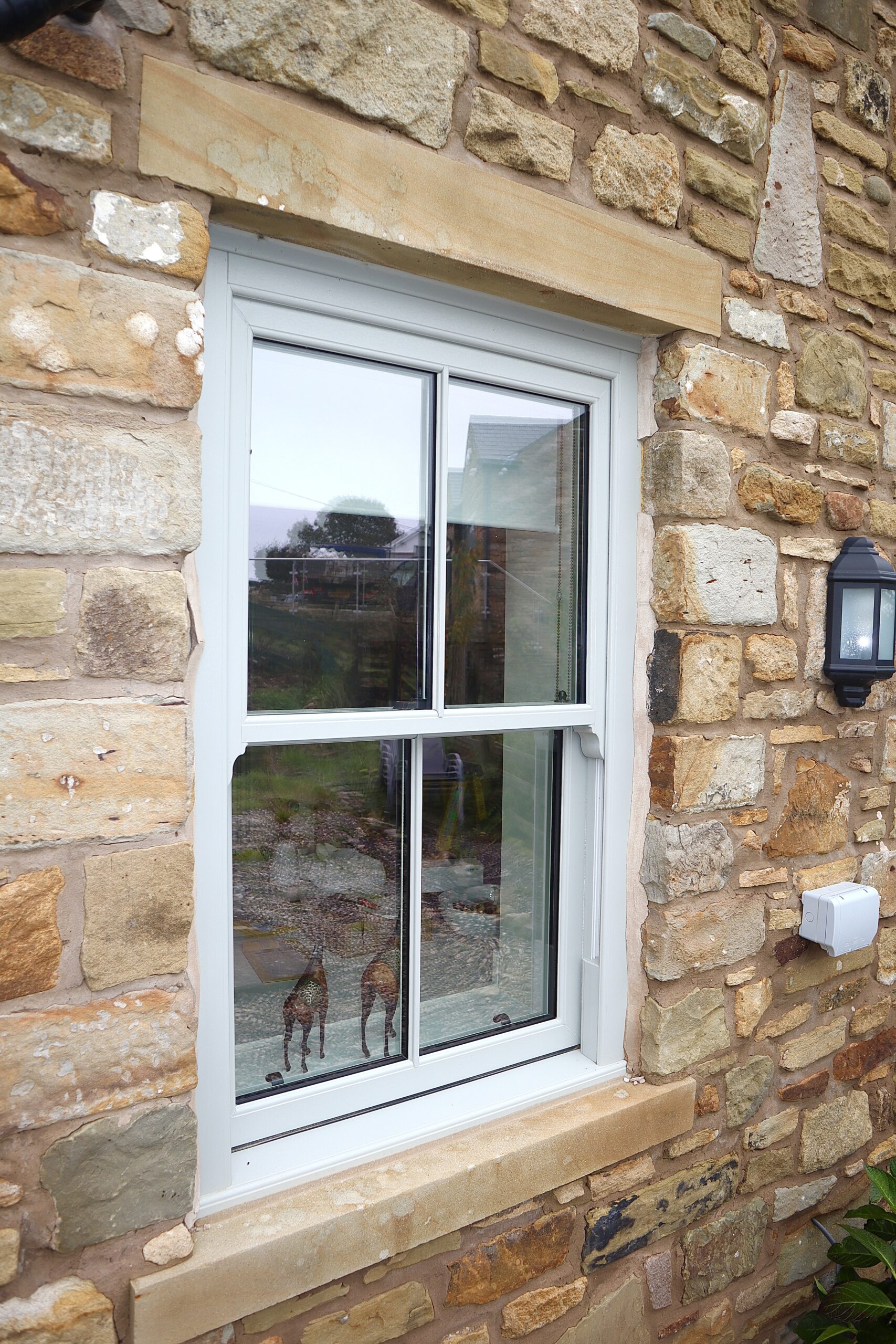 Agate grey uPVC sliding sash windows approved for use in a conservation area