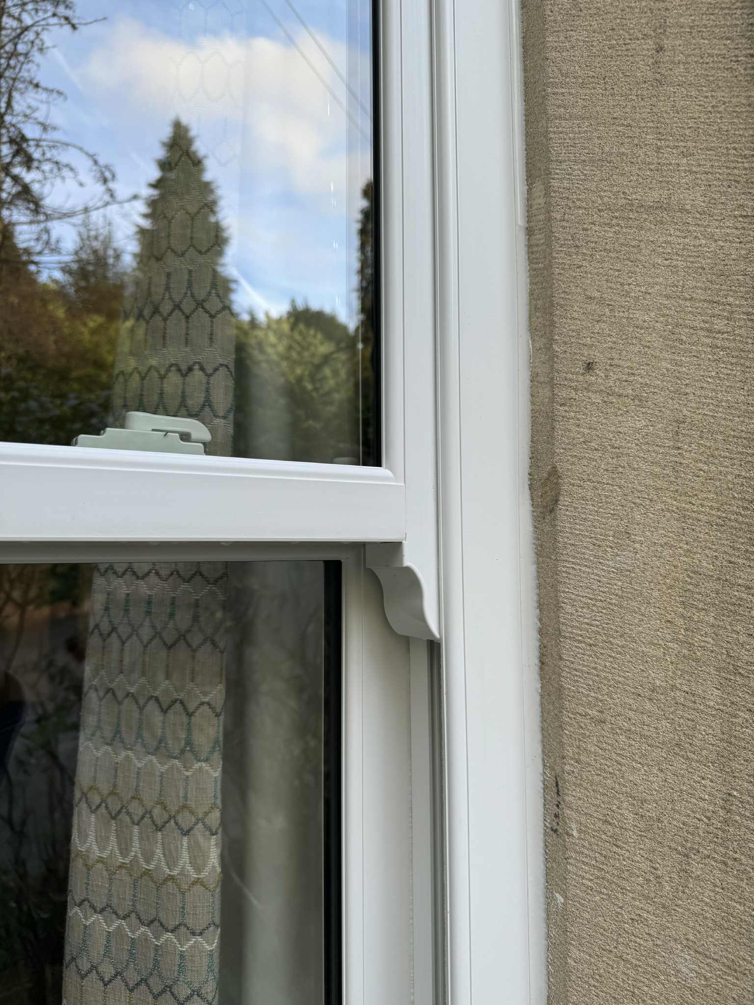 Smooth white sliding sash windows enhancing a period building while improving performance